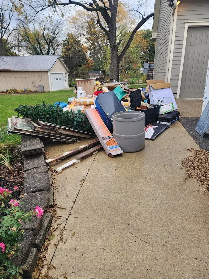 Dumpster being loaded with debris for Residential Dumpster Rental in Uniontown